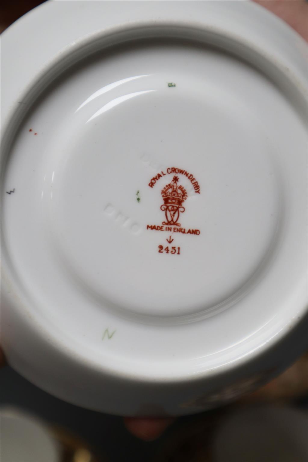 A Royal Crown Derby part tea service, pattern no. 2451, a similar vase and a sugar scuttle (faults)